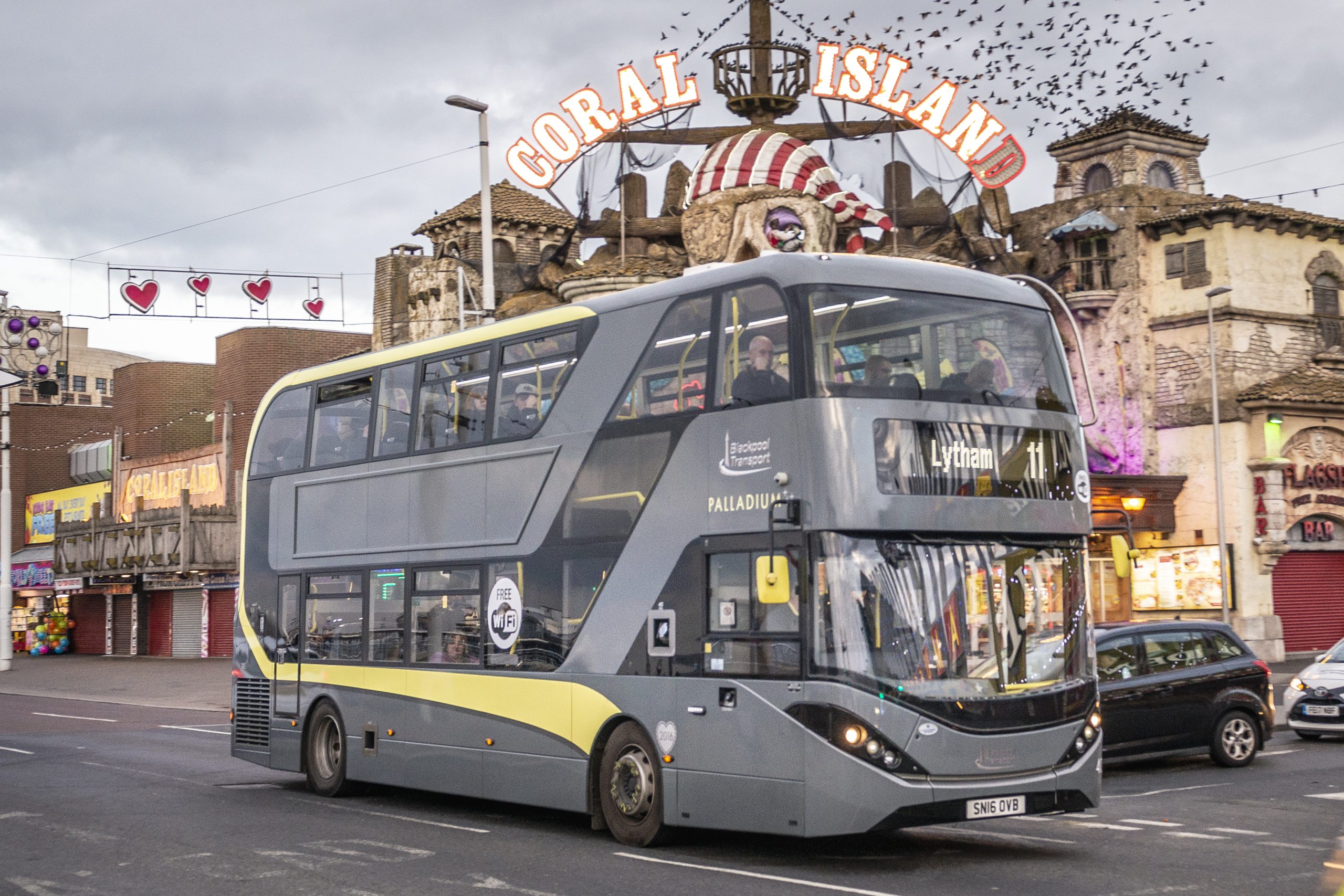 A Blackpool Transports Palladium Bus going past local attraction Coral Island