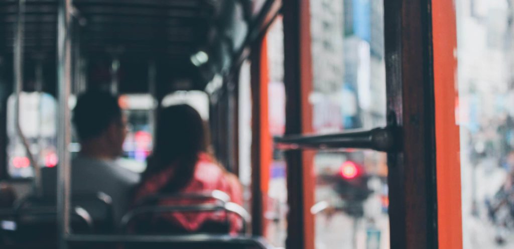 blurred photo showing passengers on bus