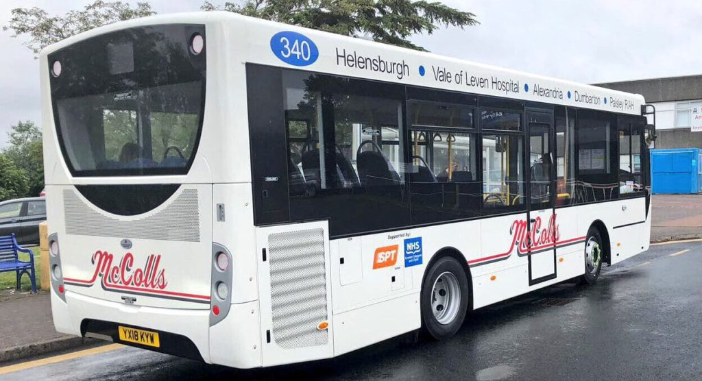 McColls bus travelling down a suburban street