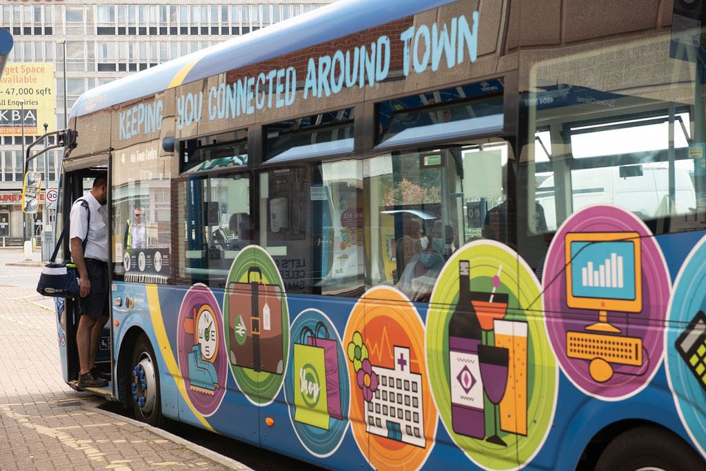 Metrobus single decker bus decorated with the slogan 'Keeping you connected around town'