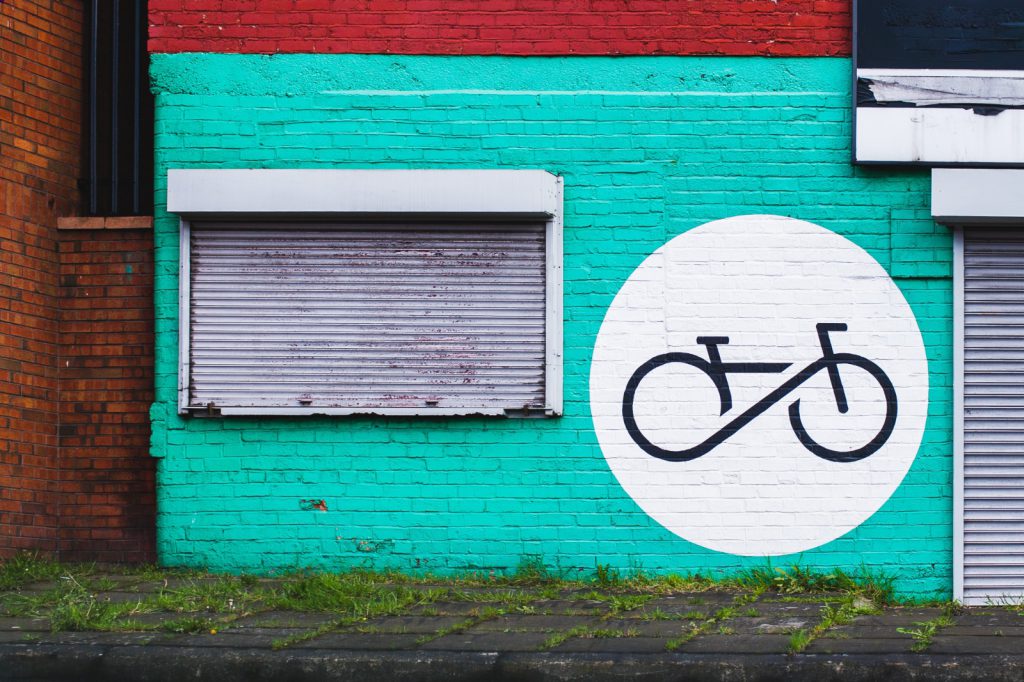 Blue wall with bicycle graffiti
