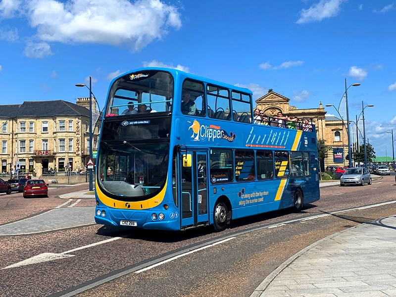 An open-top Eastern Counties First Bus, branded 'Clipper Cabriolet'